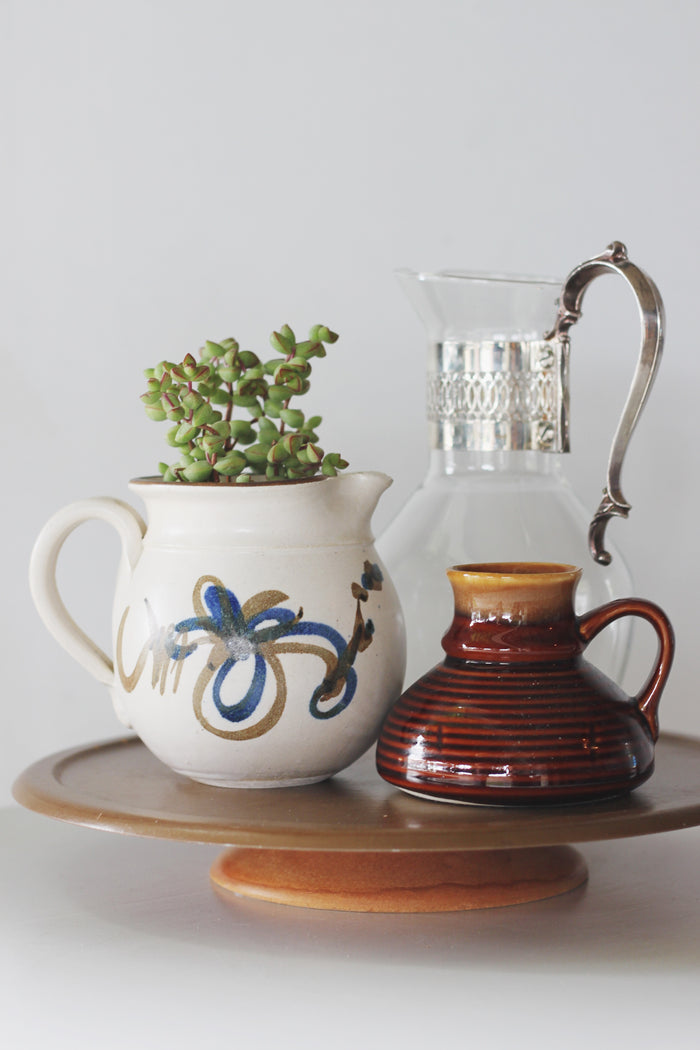 Vintage glass pitcher with silver handle