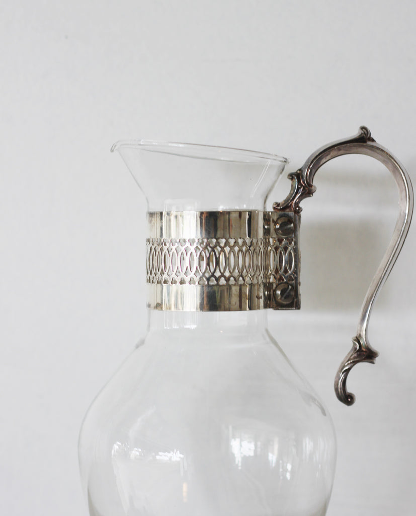 Vintage glass pitcher with silver handle