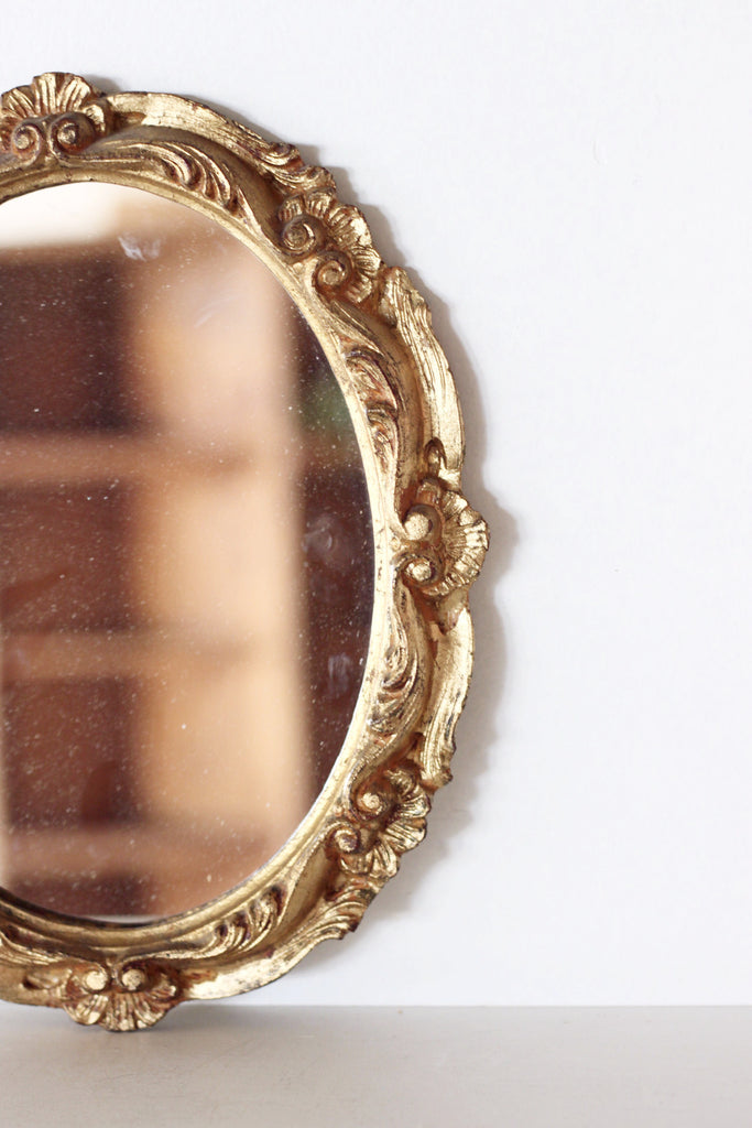 Oval gold vintage mirror